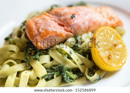 Grilled atlantic salmon fillet, with a fresh pasta salad.