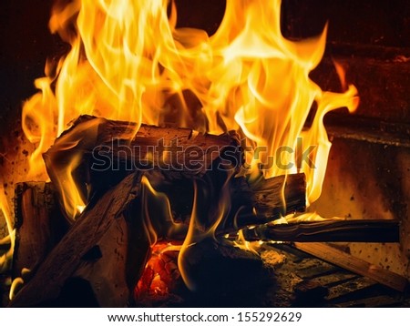 A small fire in the fireplace to smoke