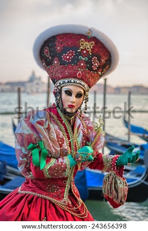 VENICE, ITALY - FEBRUARY 27, 2014: Unidentified person with Venetian Carnival mask in Venice, Italy on February 2014.  For only editorial