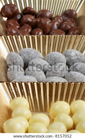 chocolates of candy in gold dish
