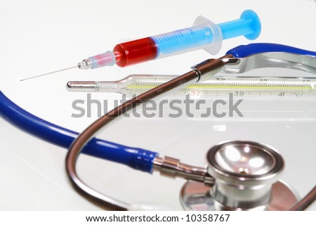 Injection isolated on white background with clinical-thermometer and stethoscope