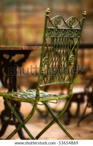 Beautiful old chair in street cafe in Tuscany - soft focus