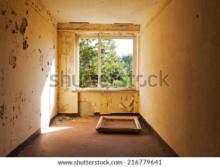 Window frame in old and abandoned room of a building