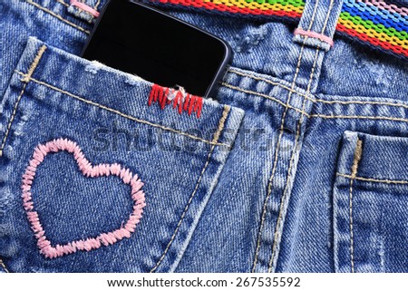 smart phone in the pocket of jeans