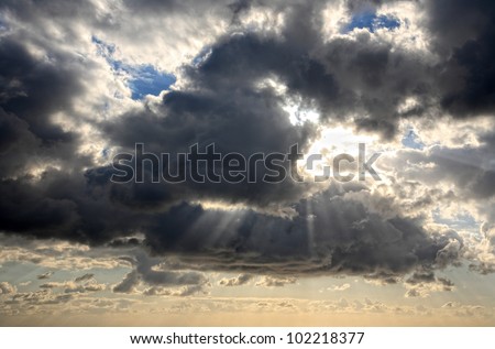 clouds with god rays on a beautiful cloudscape