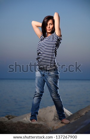 portrait of a young beautiful girl with blue sky in the afternoon