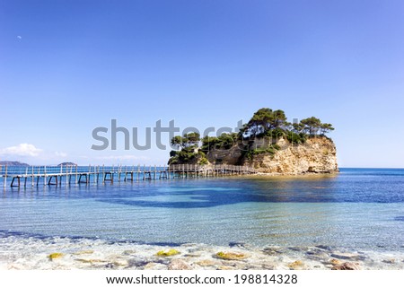 small island with wooden bridge crossing the shore  in Zante,Greece