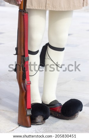 closeup of the the legs of the Greek Presidential guard called Tsoliades dressed in traditional uniform at the monument of the unknown soldier in front of the Greek  parliament,Athens 11th May 2014