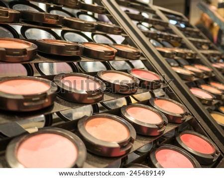Colorful display of eye makeup in an open shop with eye shadow in all the colors of the spectrum