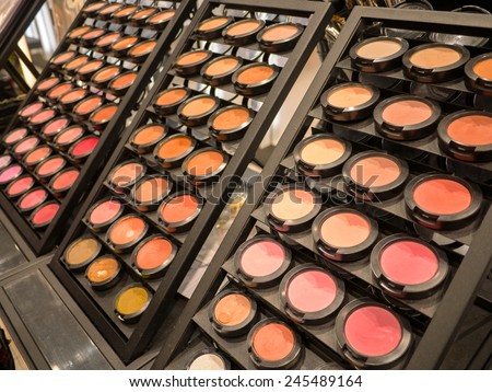 Colorful display of eye makeup in an open shop with eye shadow in all the colors of the spectrum