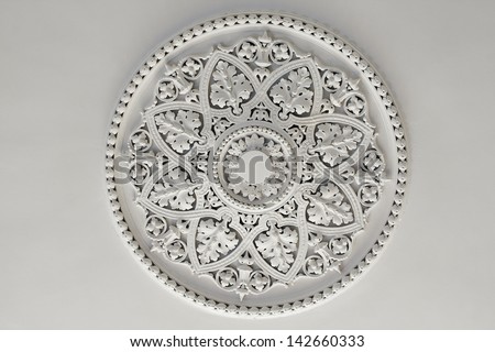 Old antique plaster ceiling plate or rose in an old victorian house