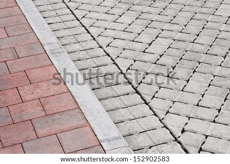 Brick paving types with pink sidewalk, curb and drive made from plain interlocking concrete bricks