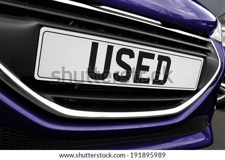 Number plate of a used cars for retail sale on a motor dealers forecourt all logos removed