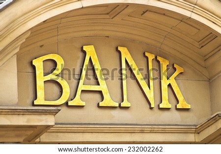 Gold Bank sign at the entrance to a Banking institute in the centre of the financial sector.