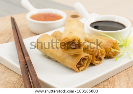 Spring Rolls - Fried duck spring rolls served with soy sauce and sweet chili dip.