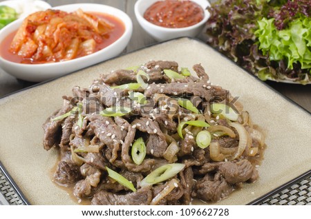Beef Bulgogi - Korean BBQ beef served with kimchi, spicy ssamjang, chillies, garlic and lettuce leaves.