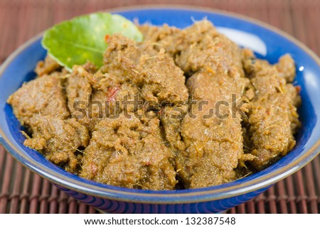 Rendang Daging - Dried beef curry with coconut milk and spices. Traditional Indonesia, Malaysian and Singaporean dish.