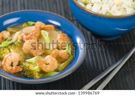 Prawns with Ginger and Spring Onion - Chinese dish of prawns, broccoli and water chestnuts with ginger and spring onion sauce served with egg fried rice.