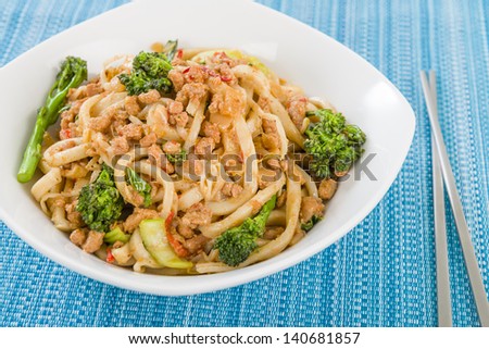 Dan Dan Noodles - Chinese noodles with minced pork and sprouting broccoli in a fragrant spicy sauce. Sichuan cuisine.