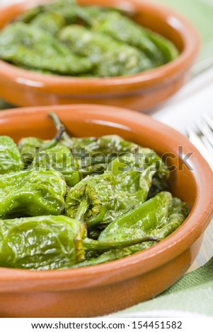 Padron Peppers - Fried Spanish green peppers with olive oil and sea salt. Traditional Spanish tapas.