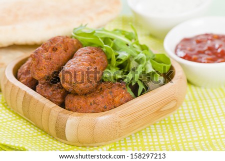 Koftas - Asian style meatballs served with salad and pita bread, chili sauce and yoghurt.