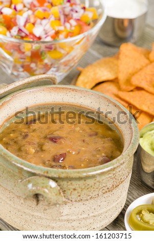 Vegetarian Chili - Chili made with soy protein and beans served with tortilla chips, pico de gallo, jalapenos, guacamole and sour cream.