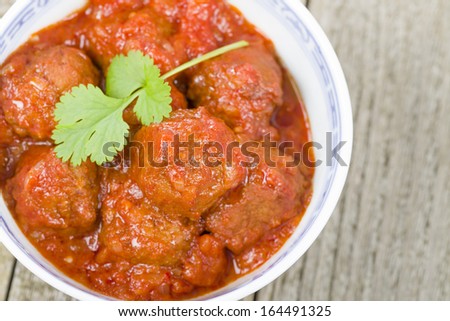 Xiu Mai - Vietnamese spicy pork meatballs in fragrant tomato sauce.