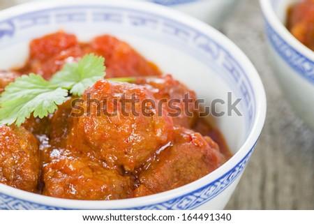 Xiu Mai - Vietnamese spicy pork meatballs in fragrant tomato sauce.