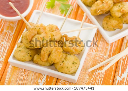 Crispy Prawns Skewers - Asian style fried battered prawns on skewers served with sweet chili dip.