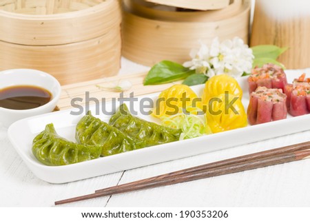 Jiaozi, Har Gow, and Siu Mai - Chinese colourful steamed dumplings. Traditional dim sum set.