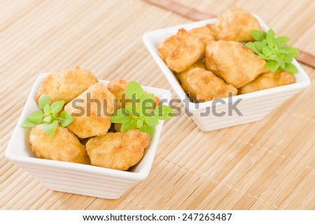 Chicken Nuggets - Battered and deep fried chicken pieces.