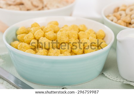 Golden Nuggets - Whole grain cereals in a green bowl.