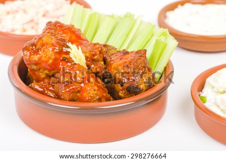 Buffalo Wings - Hot and spicy buffalo chicken wings with celery and cheese dip.