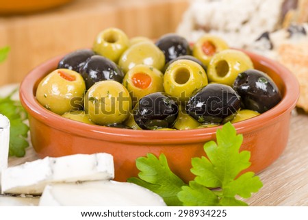 Goat\'s Cheese & Olives - Full fat mould ripened soft goat\'s milk cheese served with mixed olives and kalamata bread.