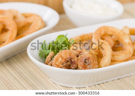 Calamari - Deep-fried squid rings served with garlic mayo and chili sauce.