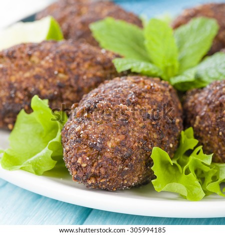 Kibbeh - Middle Eastern minced meat and bulghur wheat fried snack. Also popular party dish in Brazil (kibe).
