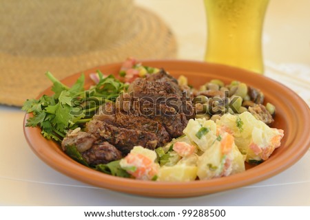 BBQ Beef - Grilled beef served with potato salad, salsa and black eyed pea salad. Churrasco Brasileiro.