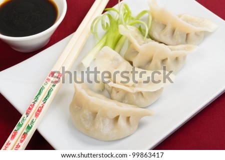 Jiaozi - Chinese dumplings filled with pork and spring onions. Dim Sum