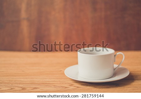 coffee cup with shallow depth-of-field, vintage style.