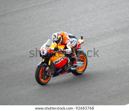SEPANG,MALAYSIA-OCT.21:Andrea Dovizioso of Repsol Honda Team in action during a practice session of the Shell Advance Malaysian Moto GrandPrix on Oct. 21 2011 in Sepang, Malaysia.