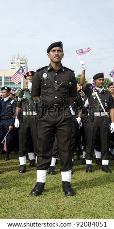KUANTAN- SEPT 16: Members of Malaysian Jail Police in the National Day and Malaysia Day parade, celebrating the 54th anniversary of independence on September 16, 2011 at Kuantan, Pahang, Malaysia.