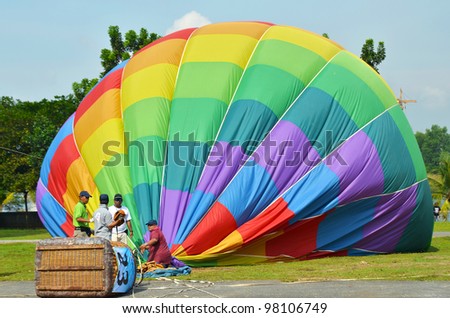 PUTRAJAYA, MALAYSIA-MAR 17: Hot air balloon is being shut down at the 4th Putrajaya International Hot Air Balloon Fiesta on Mar 17, 2012 Putrajaya. The event held in Precinct 2, Putrajaya, Malaysia.