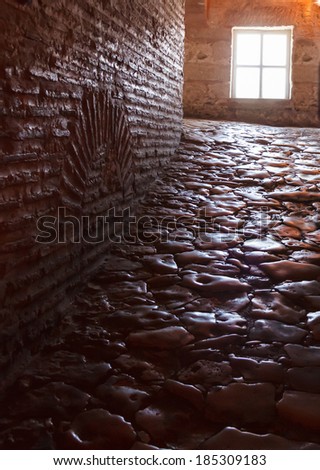 dark hallway with polished pebbles on the floor passageway inside Hagia Sophia Basilica, Istanbu Turkey
