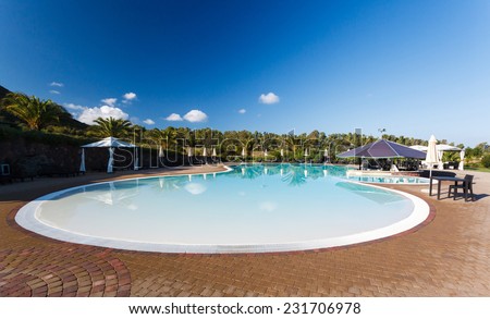 hotel swimming pool at the early morning on background of blue sky
