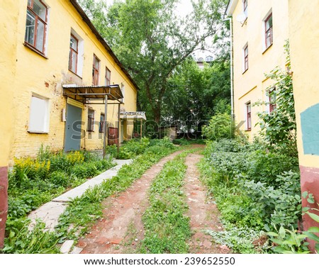 passage and the road in the slums, wood waste and debris, Russia