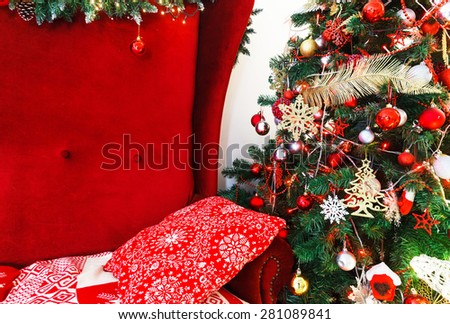 composition with red chair and Christmas tree with balls