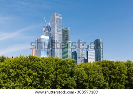 green trees on background modern built the skyscrapers in the Moscow city