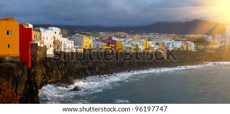 colorful houses on a cliff by the ocean in Puerto de la Cruz