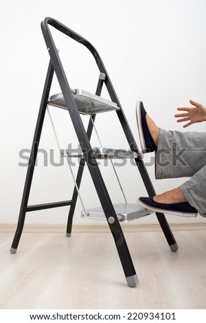 A housewife falling from a ladder showing importance of  home safety and health.