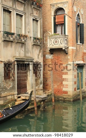 Venetian architecture. Typical Venetian Gothic houses along the canal, with a gondola under the windows. Venice, Italy